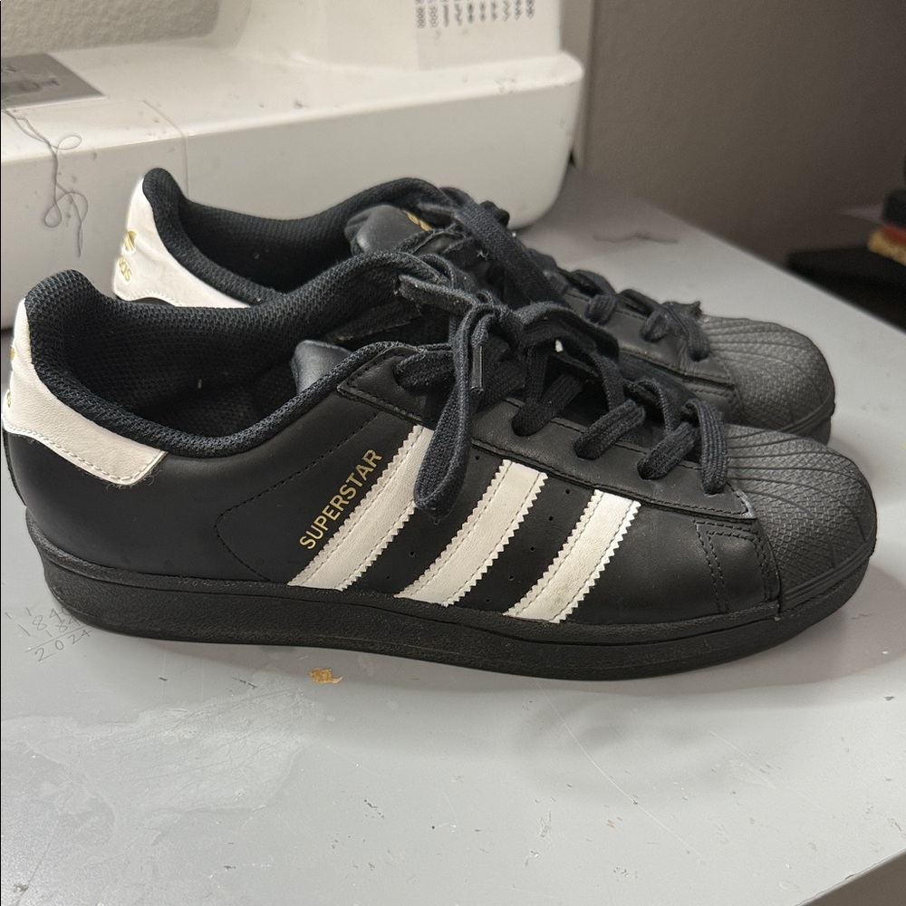 Adidas Black and White Sneakers with Gold Logo